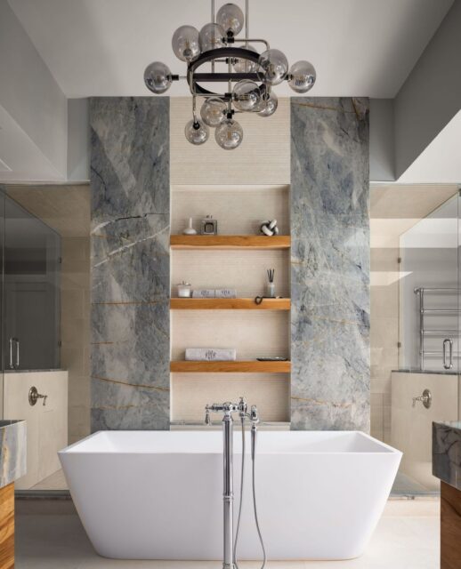 The stone is the statement, but the functionality is what sets the #ProjectVistaMeadow primary bathroom apart.⁠⁠Every slab was thoughtfully placed to create a seamless, cohesive feel across the vanity, shower, and built-in details. Paired with generous storage and durable finishes, it's a space designed to evolve alongside a growing family without sacrificing luxury.