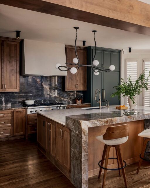 Most kitchens pick one bold element and stop there. #ProjectCasaBesito went all the way.Mixing walnut cabinetry with a deep green paint, we let the stone do the talking, carrying two intricate, show-stopping pieces through the backsplash and an elevated island, anchoring the whole space.See how we play with color, texture, and material through the whole house on our website.