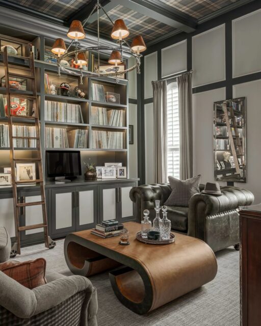 The best rooms tell you who lives there before you notice the furniture.Here, it’s the vinyl collection climbing the shelves, the framed jerseys, the leather and brass that make it feel collected rather than curated. A rolling ladder does the practical work while the details do the storytelling.See the full project at the link in bio.